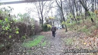Daring girls pissing on the frequented pathway and are meeting by passers-by