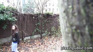 Daring girls pissing on the frequented pathway and are meeting by passers-by