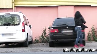 Yummy girls into tight jeans made it still into time to squat down and peeing off the road