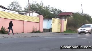 Yummy girls into tight jeans made it still into time to squat down and peeing off the road