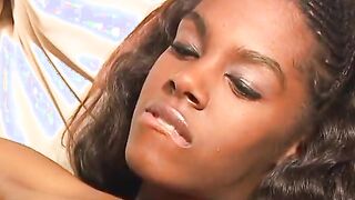 Ebony lesbo gets plowed with strap-on