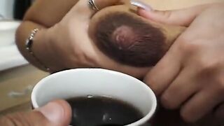 Hoe is on her knees sucking off on 2 dicks at once