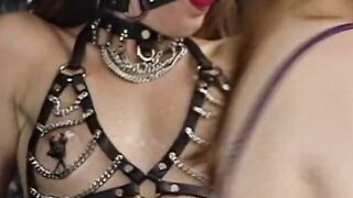 Blonde dom restrains thin dark haired with ball gag
