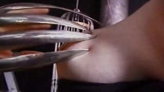 Gf teases tied leather skank's pierced clitoris with clamp