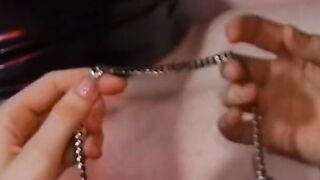 Gf teases tied leather skank's pierced clitoris with clamp