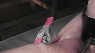 Leather domina licks and clamps guy's tightly-roped