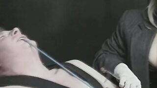 Tied man is subdued with strange cock remedy by 2 chicks