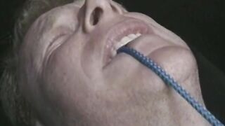 Tied man is subdued with strange cock remedy by 2 chicks