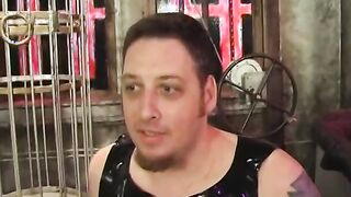 Broad punishes submissive guy on St. Andrews cross