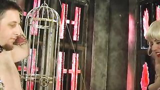 Broad punishes submissive guy on St. Andrews cross