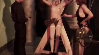 Hottie blonde is tied into red and has clamps applied by sadist