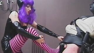 Older domina pours Cutie wax on guy's nuts and dick