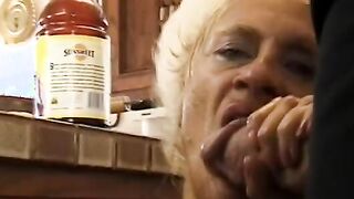Messy granny blows delivery guys's dick