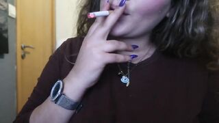 CLOSE UP CIGAR SMOKE BY A HOT BLONDE WOMAN