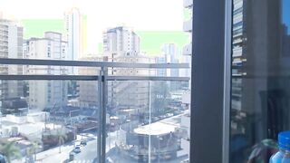 Supergirl Dressed flashing melons inside balcony