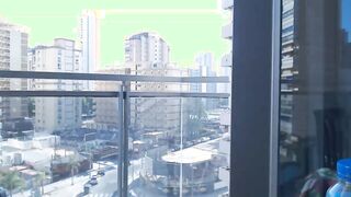 Supergirl Dressed flashing melons inside balcony
