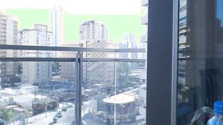 Supergirl Dressed flashing melons inside balcony