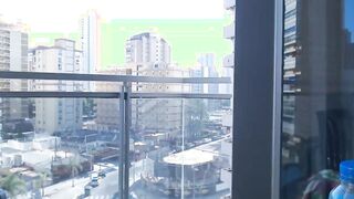 Supergirl Dressed flashing melons inside balcony
