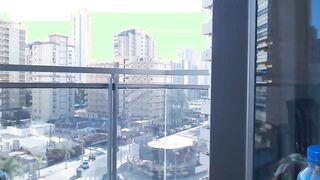 Supergirl Dressed flashing melons inside balcony