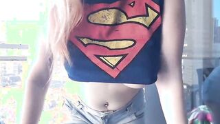Supergirl Dressed flashing melons inside balcony
