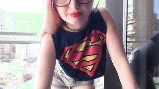 Supergirl Dressed flashing melons inside balcony