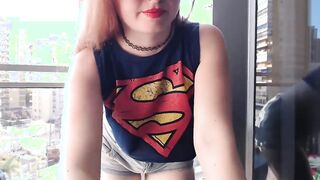 Supergirl Dressed flashing melons inside balcony
