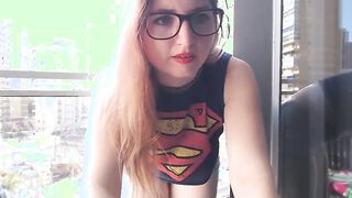 Supergirl Dressed flashing melons inside balcony