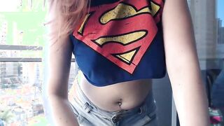 Supergirl Dressed flashing melons inside balcony
