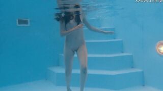 Skinny Russian Marfa swims naked into the pool