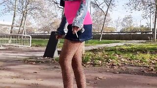 Curvy into ripped stockings walking and performance her booty outdoors