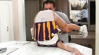 Pretty young cheerleader fucks inside the kitchen and gets a mouthful of cum