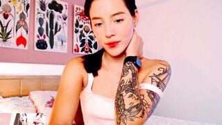 Bombshell petite Colombian with a inked body seduces you from her bed with her amazing figure