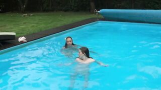 Marfa touches Emerald Ocean Cutie inside the pool