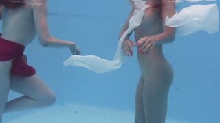 Marfa touches Emerald Ocean Cutie inside the pool