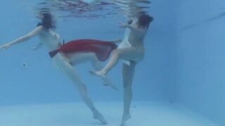 Marfa touches Emerald Ocean Cutie inside the pool