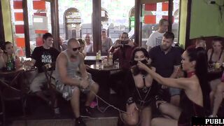 Publicly humiliated slave blowing penis with voyeurs watching