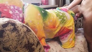 A baby into a unicorn costume shows off her booty