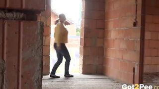 Blonde 18 year old pisses on a building site to relieve pissing desperation