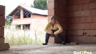 Blonde 18 year old pisses on a building site to relieve pissing desperation