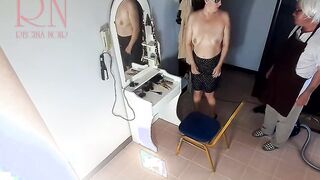 Camera inside naked barbershop. Hairdresser makes undress lady ho cut her hair. Barber, nudism. WEBCAM two