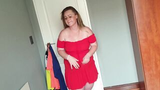 Fat women having fun dress up by trying on different dresses