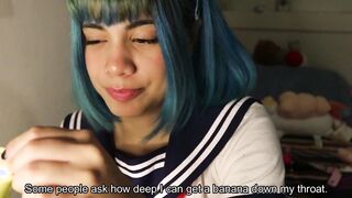 Deep throat: college girl slips a whole banana inside her mouth.