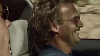 Classic dark hair with long boobies blows and fucks dudes by the vehicle
