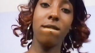 Black beauty gets her lips around a long african dick