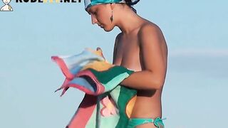 Porno of slim naked chicks on a nudist beach Relaxing and talking