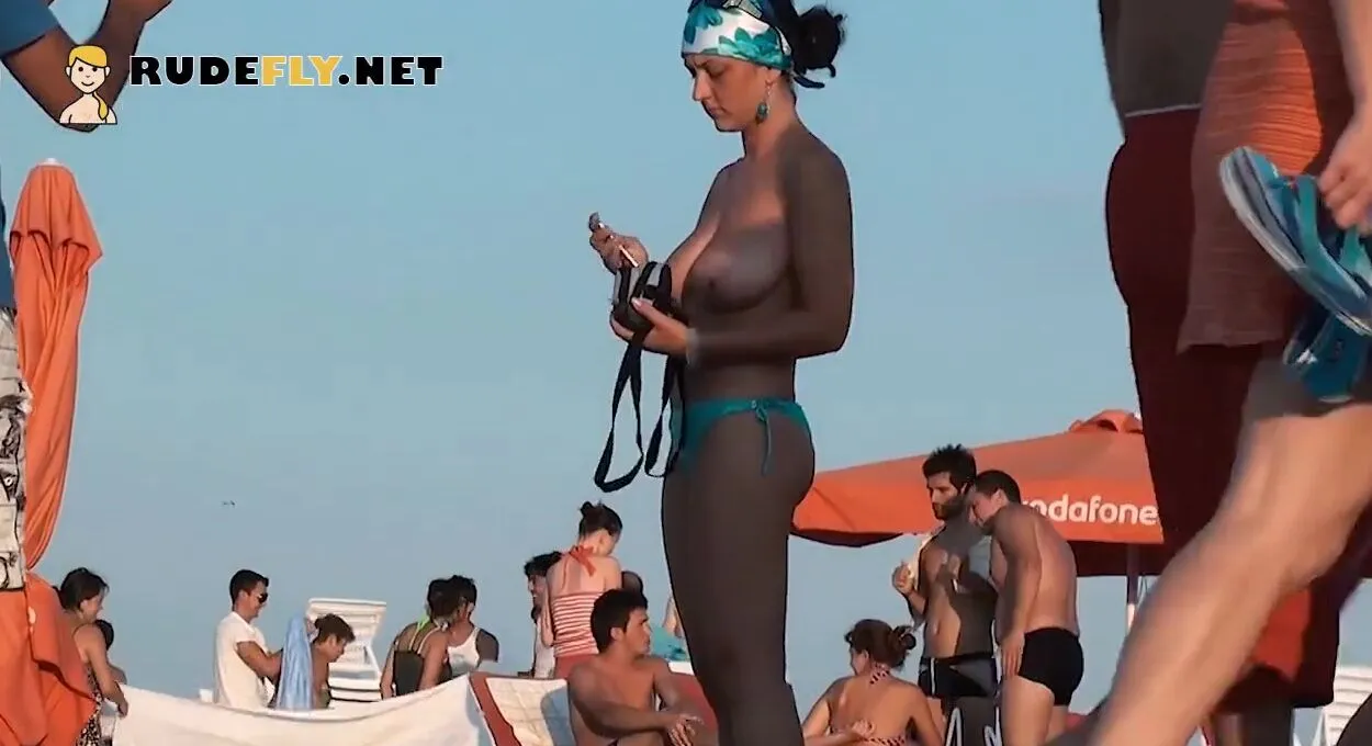 Porno of slim naked chicks on a nudist beach Relaxing and talking