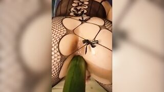 little game with this long cucumber into my fishnet jumpsuit