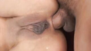 Lucky stud cracks young slender dark haired's asshole open on a red couch