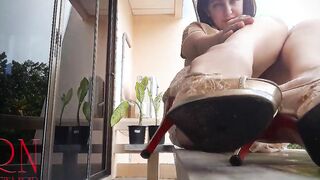 Slutty professor Regina Noir lifts her skirt and shows lingerie on the campus balcony