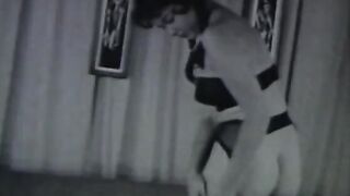 Sexy does a hand stand without a top on